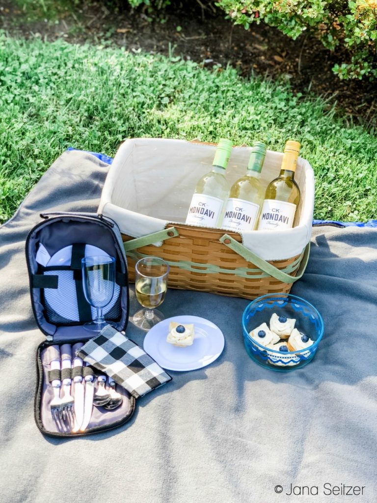 wine bottles and tarts in a picnic