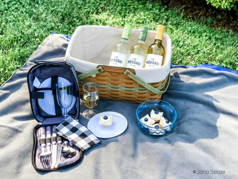 wine bottles and tarts in a picnic