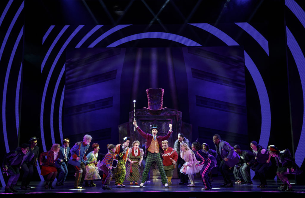 Noah Weisberg as Willy Wonka and company