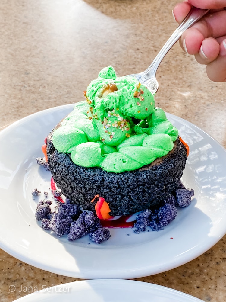 Evil Queen Cauldron Cake Oogie Boogie Bash Dining at Wine Country Trattoria